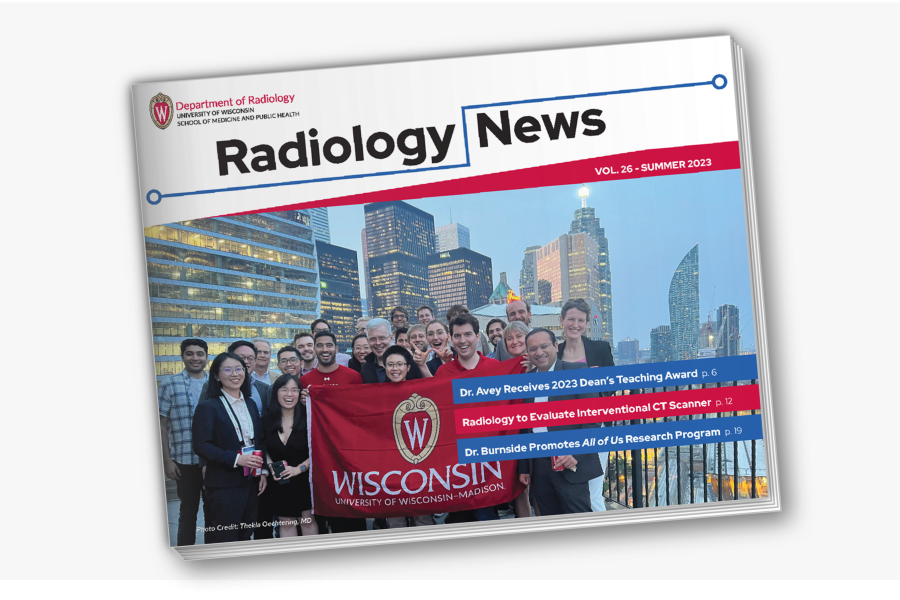 cover of the summer 2023 Radiology newsletter that features an image of people smiling as they hold a UW-Madison flag in front of the Toronto skyline.