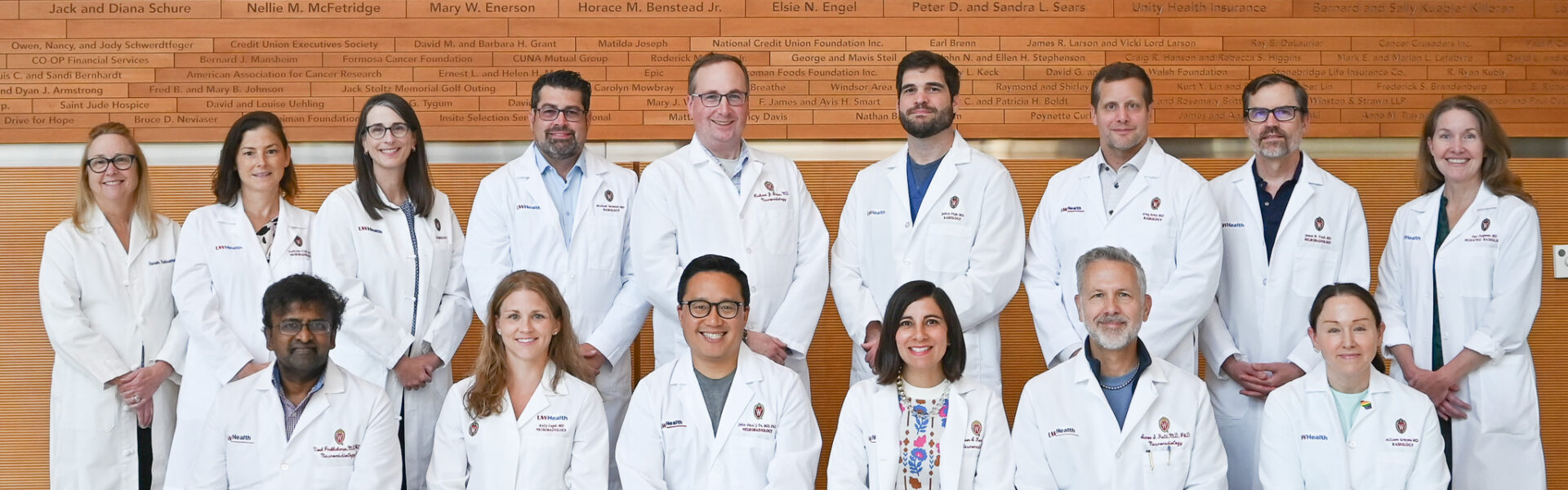 A group of neuroradiology faculty pose together.