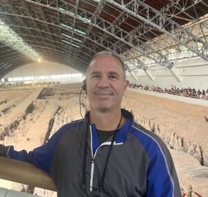 Perry Pickhardt poses in front of the Terracotta Army.